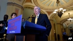 FILE - Senate Majority Leader Mitch McConnell of Kentucky speaks to reporters on Capitol Hill in Washington.