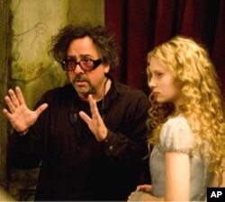Tim Burton, Mia Wasikowska on set of “Alice in Wonderland”