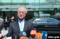FILE - International Atomic Energy Agency Director-General Yukiya Amano speaks to reporters outside the Palais Coburg, the venue for nuclear talks in Vienna, July 4, 2015.