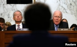 Senate Judiciary Committee Chairman Chuck Grassley, left, and ranking member Pat Leahy question Loretta Lynch during her confirmation hearing to become U.S. attorney general, on Capitol Hill in Washington, Jan. 28, 2015.