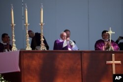 Pope Francis begins Mass in Ecatepec, Mexico, Sunday, Feb. 14, 2016. Hundreds of thousands of people gathered as Pope Francis began a Mass, expected to be the biggest event of his five-day trip to Mexico.