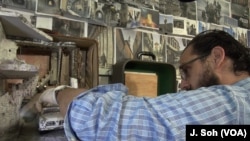 In his New Haven, CT, studio Hafez builds his miniatures with minute detail.