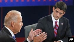 Vice President Joe Biden (l) and Republican vice presidential nominee Rep. Paul Ryan participate in the vice presidential debate at Centre College, in Danville, Kentucky, October 11, 2012.