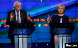 U.S. Senator Bernie Sanders debates former Secretary of State Hillary Clinton during the first official Democratic candidates debate of the 2016 presidential campaign in Las Vegas, Oct. 13, 2015.