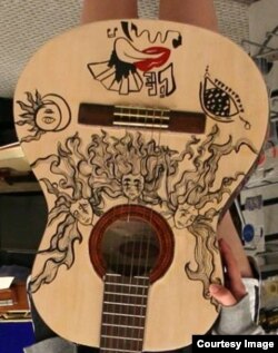 Three Sisters Heads Guitar by Carla Araneda (Courtesy Victor Litz Music Center)
