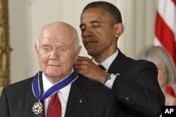President Barack Obama awards the Medal of Freedom to astronaut John Glenn in the East Room of the White House, May 29, 2012.