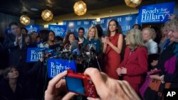 Rep. Carolyn Maloney, D-N.Y., center, speaks as a person takes a photograph during the "Last Hillary Clinton Rally" as part of the Ready For Hillary campaign in New York, April 11, 2015.