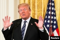 U.S. President Donald Trump gestures as he delivers remarks during the Prison Reform Summit at the White House in Washington, U.S., May 18, 2018.