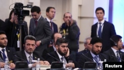 Mohammad Alloush (center), the head of the Syrian opposition delegation, attends Syria peace talks in Astana.