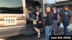 Tourists on a Columbus Food Adventure climb aboard to visit some of the city's many ethnic restaurants in Ohio.