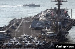 U.S. aircraft carrier USS Carl Vinson arrives for an annual joint military exercise called "Foal Eagle" between South Korea and U.S, at the port of Busan, South Korea, March 15, 2017.