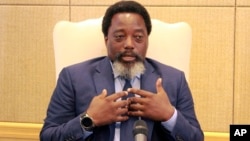 Democratic Republic of Congo's President Joseph Kabila speaks during an interview by the Associated Press at the Nation's Palace in Kinshasa, Dec. 9, 2018.