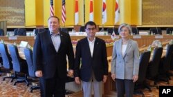 From left, U.S. Secretary of State Mike Pompeo, Japan's Foreign Minister Taro Kono, and South Korea's Foreign Minister Kang Kyung-wha pose for photo at the Iikura Guest House in Tokyo, Japan, July 8, 2018.