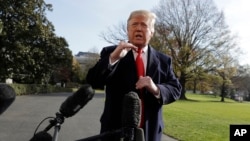 President Donald Trump talks with reporters before traveling to the G-20 Summit in Buenos Aires, on the South Lawn of the White House, Nov. 29, 2018, in Washington.