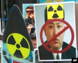 A South Korean protester shouts slogans during a rally denouncing North Korea's latest nuclear test in Seoul, South Korea, Sept. 10, 2016.