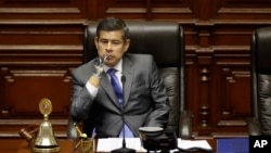National Congress President Luis Galarreta presides over a special session on whether to initiate impeachment proceeding against the country's president, in Lima, Peru, Dec. 15, 2017. Lawmakers went onto to approve impeachment proceedings against President Pedro Pablo Kuczynski.