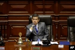 National Congress President Luis Galarreta presides over a special session on whether to initiate impeachment proceeding against the country's president, in Lima, Peru, Dec. 15, 2017. Lawmakers went onto to approve impeachment proceedings against Preside