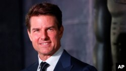 FILE - Actor Tom Cruise poses while promoting a film in Mexico City, June 5, 2017.
