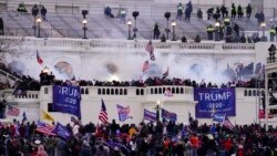 In this Wednesday, Jan. 6, 2021, file photo, violent protesters, loyal to President Donald Trump, storm the Capitol, in Washington. (AP Photo/John Minchillo, File)
