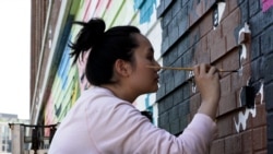Amanda Phingbodhipakkiya, a multidisiciplinary artist based in Brooklyn, New York, painted a mural in Washington, D.C. in May, 2021.