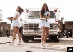 Nurse Mona [Elise Avellan, left] and Nurse Lisa [Electra Avellan] take a break from healing to wage war against an army of vigilantes.