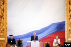 Vladimir Putin is sworn in as the new Russian President during a ceremony at the Kremlin in Moscow on May 7, 2018. (AFP photo / Sputnik)