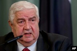 Syrian Foreign Minister Walid Mouallem speaks to the media after talks in Moscow, Sept. 9, 2013.