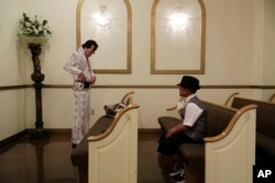 Eddie Powers prepares to perform a wedding at the Shalimar Wedding Chapel in Las Vegas, Aug. 1, 2017. Elvis impersonators remain a staple of Las Vegas kitsch, performing in wedding chapels and casino venues and on street corners.