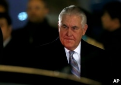 FILE - U.S. Secretary of State Rex Tillerson arrives at Haneda international airport in Tokyo, March 15, 2017.