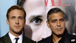 Director, writer, and cast member George Clooney, and cast member Ryan Gosling at the premiere of "The Ides of March" which won for Best Adapted Screenplay. (AP PHOTO)