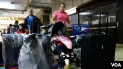 Natalie Pereira queues up to go through immigration control at Maiquetia airport in Caracas in 2014 before her move to the U.S. with her family after winning the Green Card lottery.