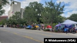 Trump supporters have set up camp since Monday morning, a block away from his reelection rally venue.