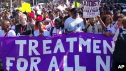In this file photo, civil rights activists march in Durban, South Africa, July 18, 2016 at the start of the 21st World Aids Conference.
