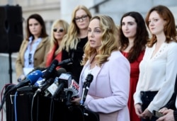 Actress Louisette Geiss addresses the media at a news conference by the "Silence Breakers," a group of women who have spoken out about Hollywood producer Harvey Weinstein's sexual misconduct, at Los Angeles City Hall, Feb. 25, 2020, in Los Angeles.