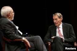 FILE - Anchor Charlie Rose, right, questions Iran's Foreign Minister Mohammad Javad Zarif at an event held in conjunction with the 72nd U.N. General Assembly in New York, Sept. 27, 2017.