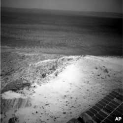 This image sent by NASA’s Opportunity rover on Jan. 7, 2015 shows a view from atop a Martian hill.