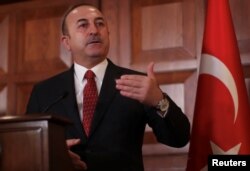 Turkish Foreign Minister Mevlut Cavusoglu speaks during a news conference in Ankara, Turkey, Jan. 14, 2019.