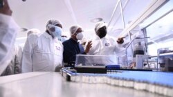 South African President Cyril Ramaphosa, right, heads a government delegation on a visit to ASPEN Pharmaceuticals in Port Elizabeth, South Africa, Monday, March 29, 2021. (AP Photo)