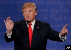 FILE - Republican presidential nominee Donald Trump during the third presidential debate with Democratic presidential nominee Hillary Clinton at UNLV in Las Vegas, Oct. 19, 2016.