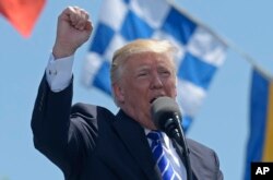 President Donald Trump gives the commencement address at the U.S. Coast Guard Academy in New London, Connecticut, May 17, 2017.