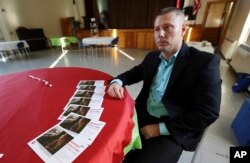 Pat Cronin, right, a director at the Northeast Addictions Treatment Center in Quincy, Mass., waits to share information and counseling at a newly opened drop-in center for substance abusers in Canton, Mass., May 9, 2018. Cronin credits his sobriety to his parents' decision to have him involuntarily committed for heroin use almost 15 years ago.