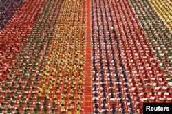 Students practice yoga in the lawns of their school ahead of International Day of Yoga, in Chennai, India, June 19, 2015.