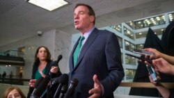 FILE - Sen. Mark Warner, D-Va., speaks after hearing some of the testimony from Michael Cohen, President Donald Trump's former lawyer, before a closed door hearing of the Senate Intelligence Committee on Capitol Hill, Feb. 26, 2019, in Washington.