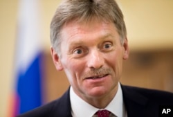 FILE - President Vladimir Putin’s spokesman Dmitry Peskov speaks to The Associated Press in Moscow.