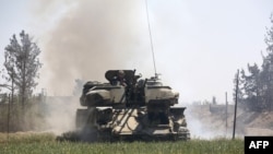 Pro-Syrian regime forces advance toward the town of Douma, eastern Ghouta, April 7, 2018, after regime troops resumed a military blitz to pressure rebels to withdraw. Backed by Russia's firepower, Backed up by Russia's firepower, Syrian President Bashar al-Assad has ousted his armed opponents from nearly all of Ghouta.