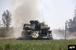 Pro-Syrian regime forces advance toward the town of Douma, the last opposition holdout in eastern Ghouta, April 7, 2018.