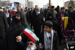 Commander of Iran's Revolutionary Guard Gen. Mohammad Ali Jafari, center, attends an annual rally commemorating the anniversary of the 1979 Islamic revolution, which toppled the late pro-U.S. Shah, Mohammad Reza Pahlavi, in Tehran, Feb. 10, 2017.