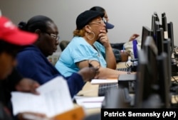 Student work on computers during a low level mathematics course at Baltimore City Community College in Baltimore, Maryland.