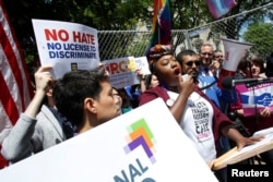 LGBT groups rally to oppose the religious freedom executive order that U.S. President Donald Trump Trump is expected to sign, outside the White House in Washington, May 3, 2017.