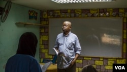 Jean Pie, teaching his class at the African Hope School, September 14, 2017.